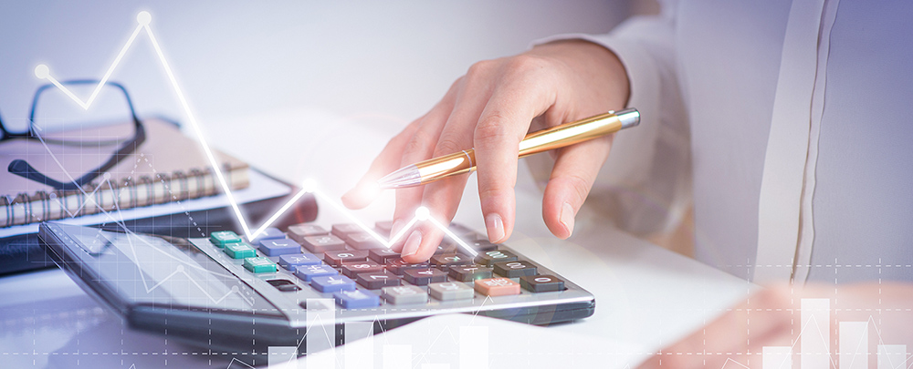 Accountant calculating profit with financial analysis graphs